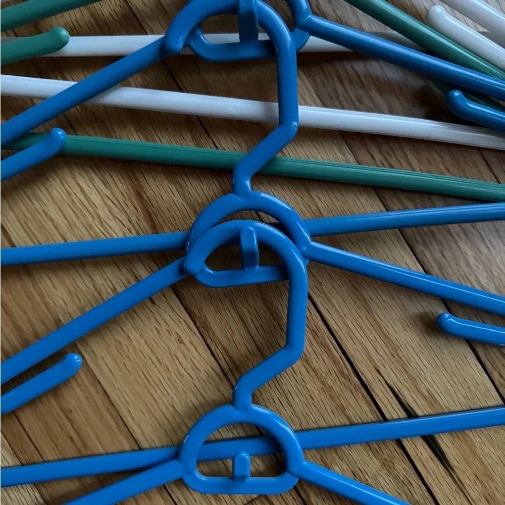 Set of Blue, Green, and White Plastic stacking Hangers